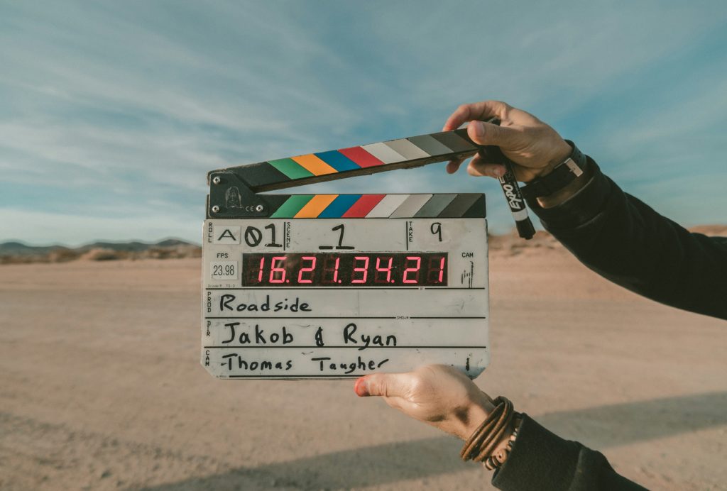 clapboard in the foreground of a desert